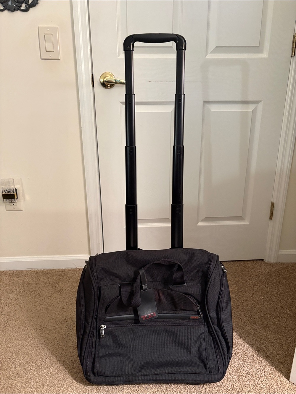 Tumi Black Rolling Travel Bag with Telescopic Handle